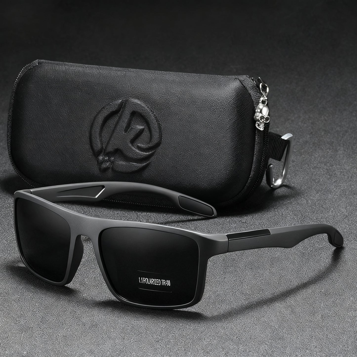 Black sunglasses with a matching case on a gray background