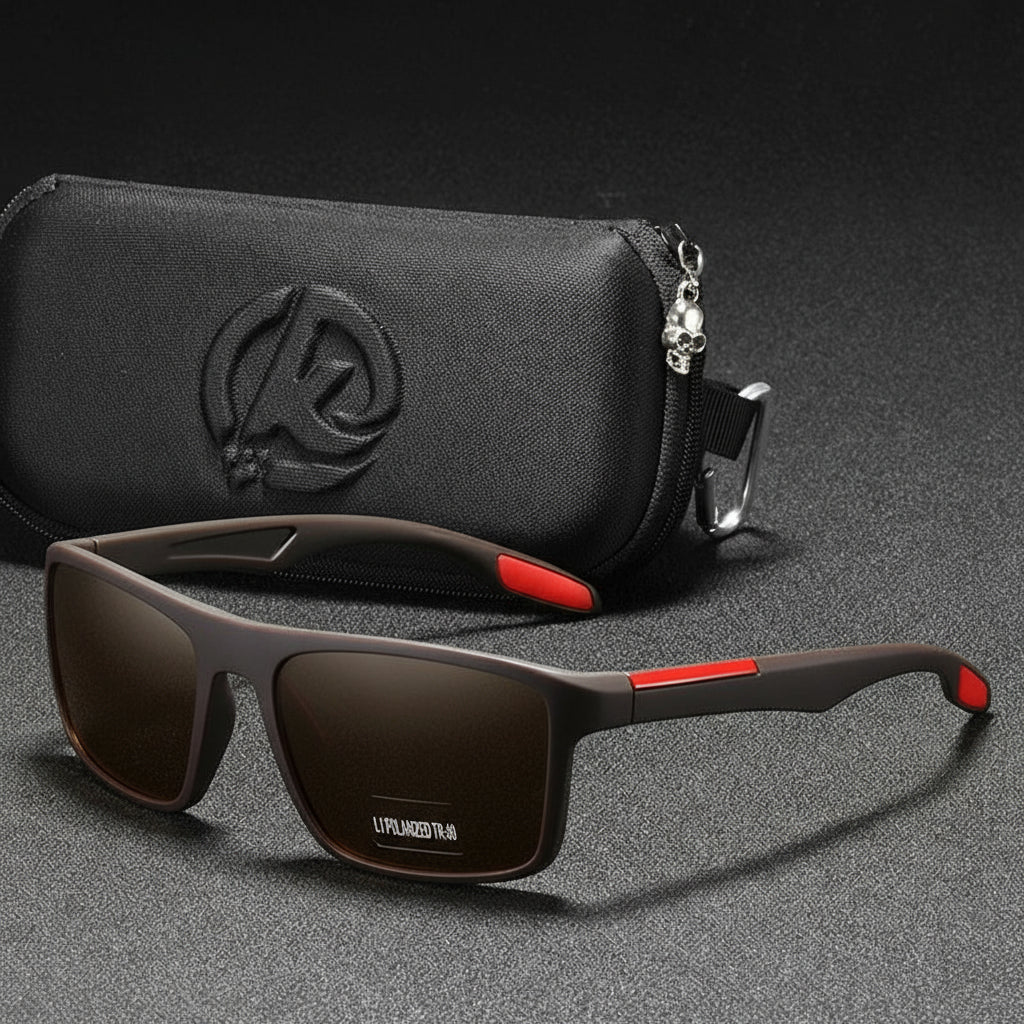 Sunglasses with red accents and a black case on a dark background
