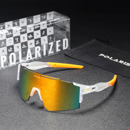 Polarized sunglasses with yellow and green gradient lenses, accompanied by a branded box and pouch on a dark surface.