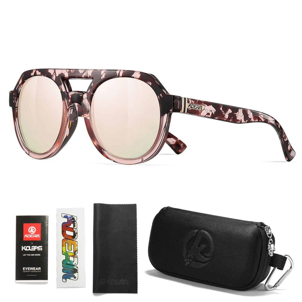 Sunglasses with pink lenses, packaging, case, and cleaning cloth on a white background