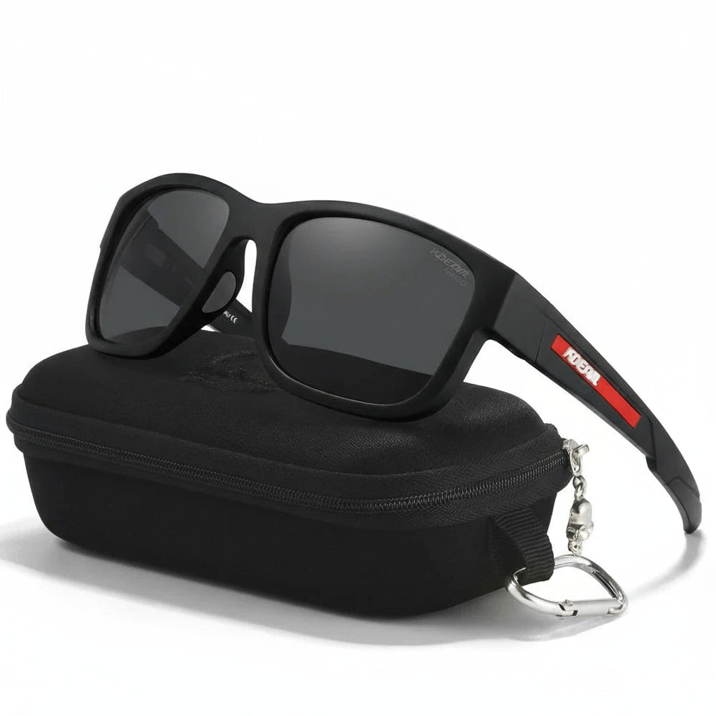 Black sunglasses with red accents on a black case, featuring the KDEAM brand.