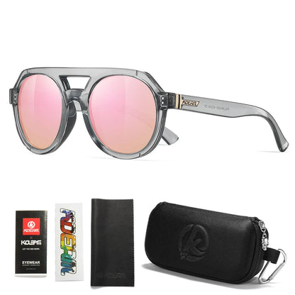 Transparent gray sunglasses with mirrored pink lenses, accompanied by a case and cleaning cloth on a white background.