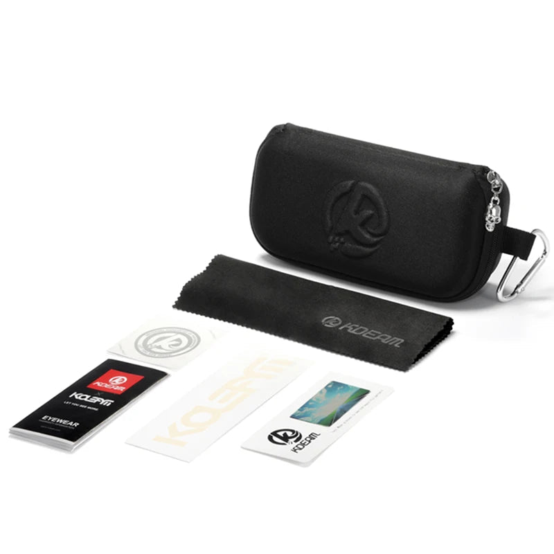 Package contents including a black pouch, cards, and a towel with a brand logo on a white background.