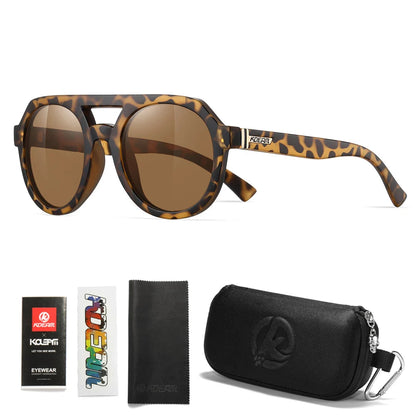 Sunglasses with leopard print frame and brown lenses, accompanied by packaging and cleaning cloth on a white background.